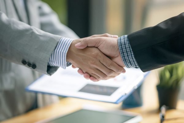 two-businessman-handshake-for-teamwork-of-business-2026-01-06-10-47-57-utc (1)